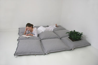 Illustration for article titled ZipZip Floor Cushions Zip Together For Sofa Fun